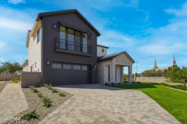 an aerial view of a house with a yard basket ball court and outdoor seating