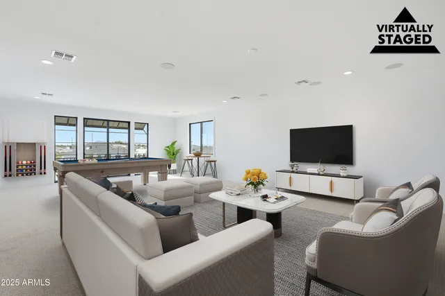 an aerial view of a house with a swimming pool yard and outdoor seating