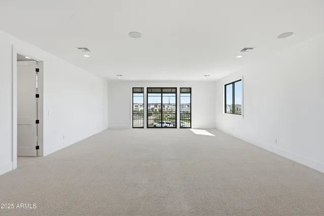 an aerial view of a house with outdoor space