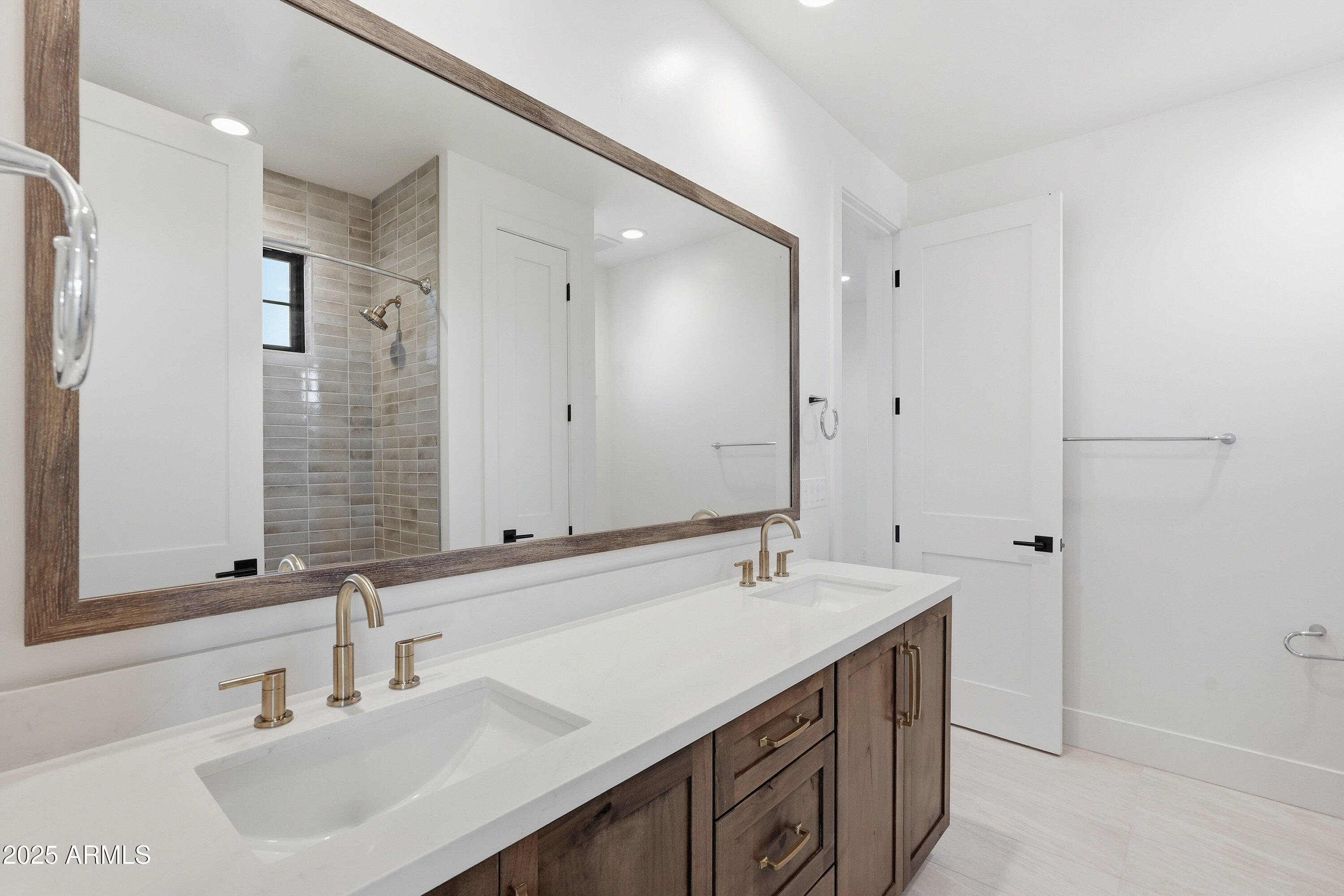 3326 South Stuart Court Gilbert, AZ 85297 - Photo 42 of 88 a bathroom with a sink double vanity and a mirror