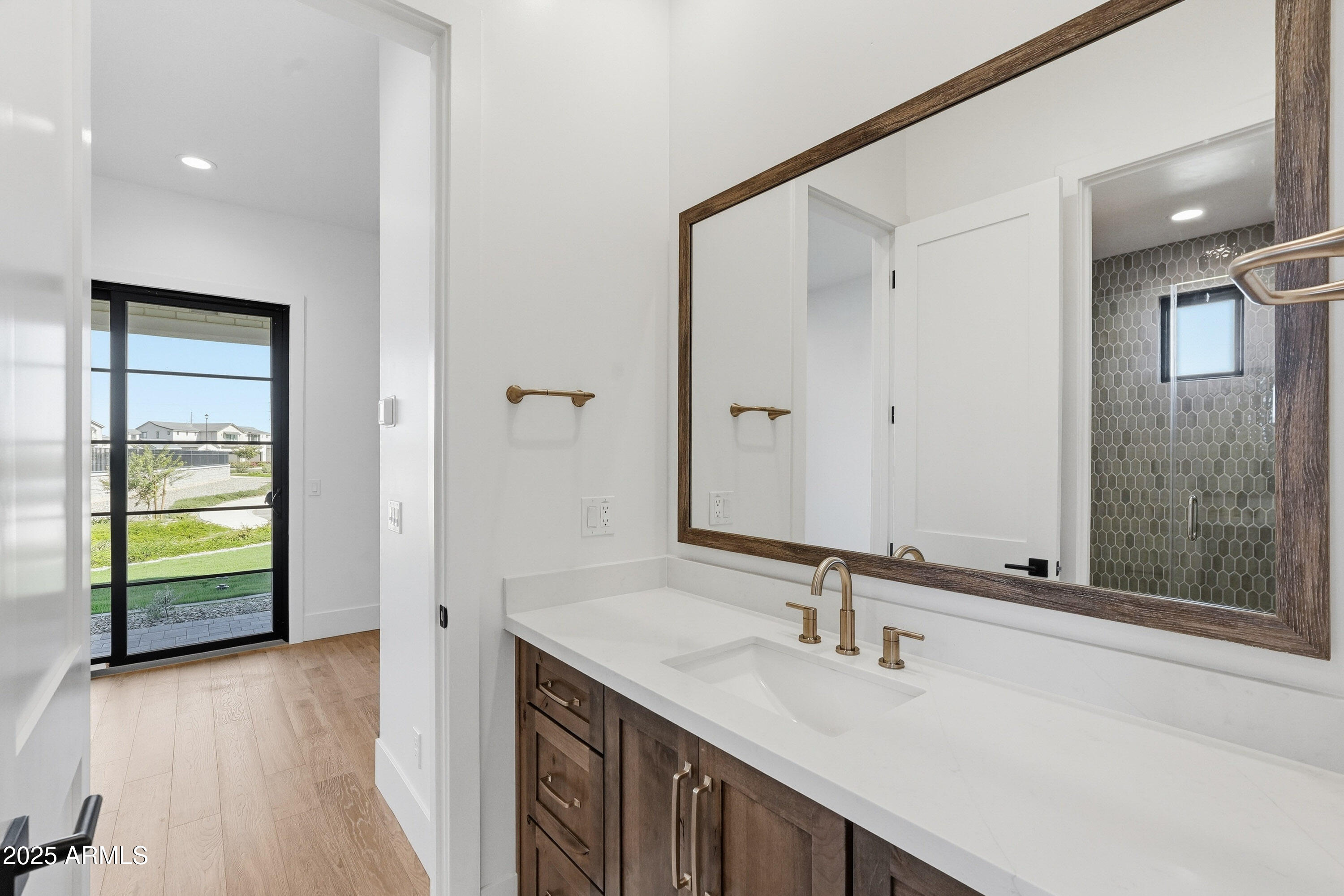 3326 South Stuart Court Gilbert, AZ 85297 - Photo 44 of 88 a bathroom with a sink and a mirror