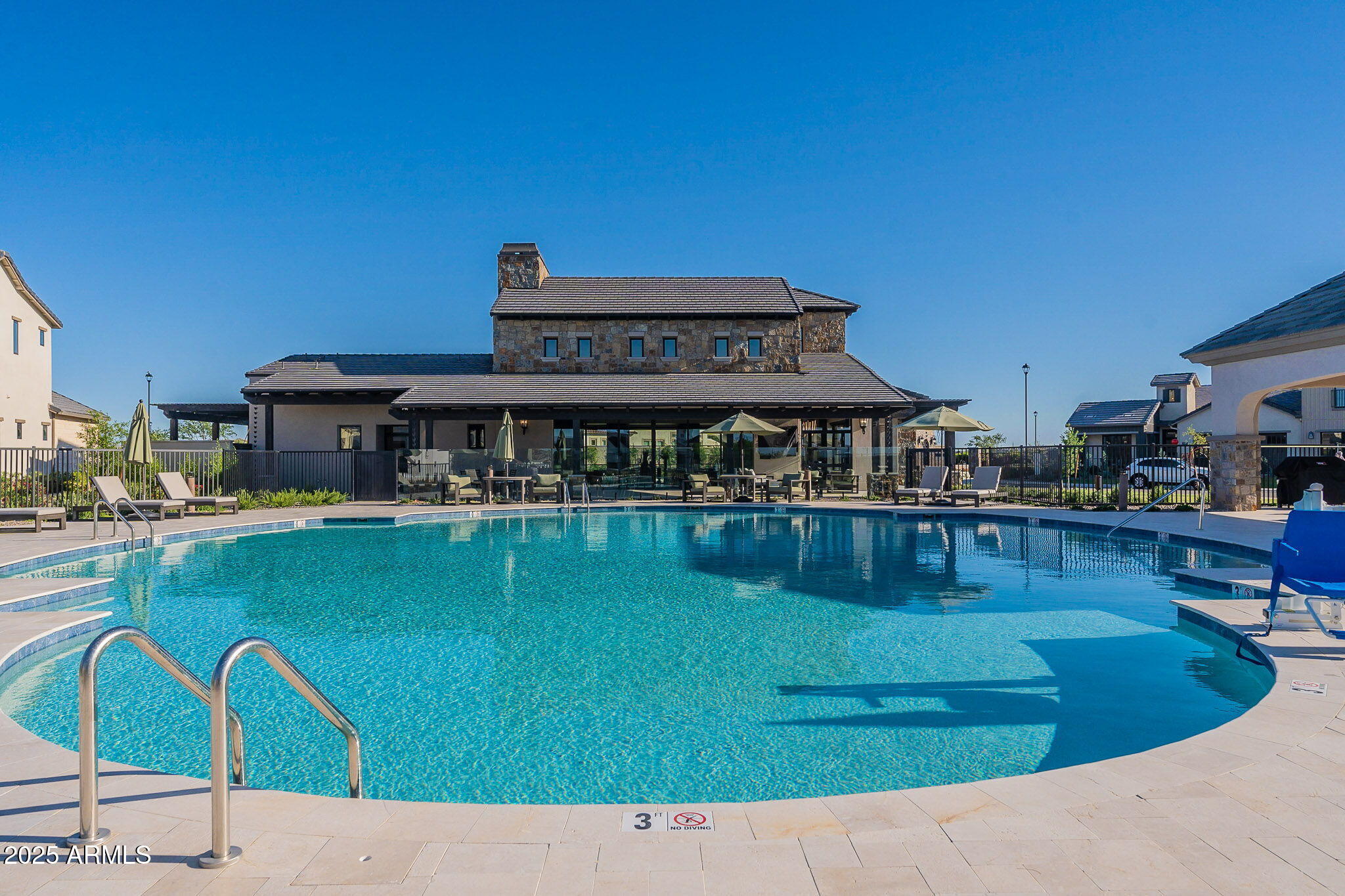 3326 South Stuart Court Gilbert, AZ 85297 - Photo 71 of 88 a view of a swimming pool with a patio