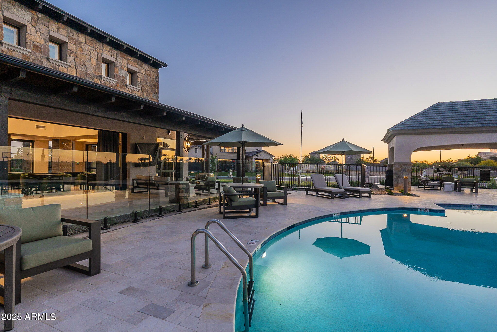 3326 South Stuart Court Gilbert, AZ 85297 - Photo 81 of 88 a view of a swimming pool with outdoor seating