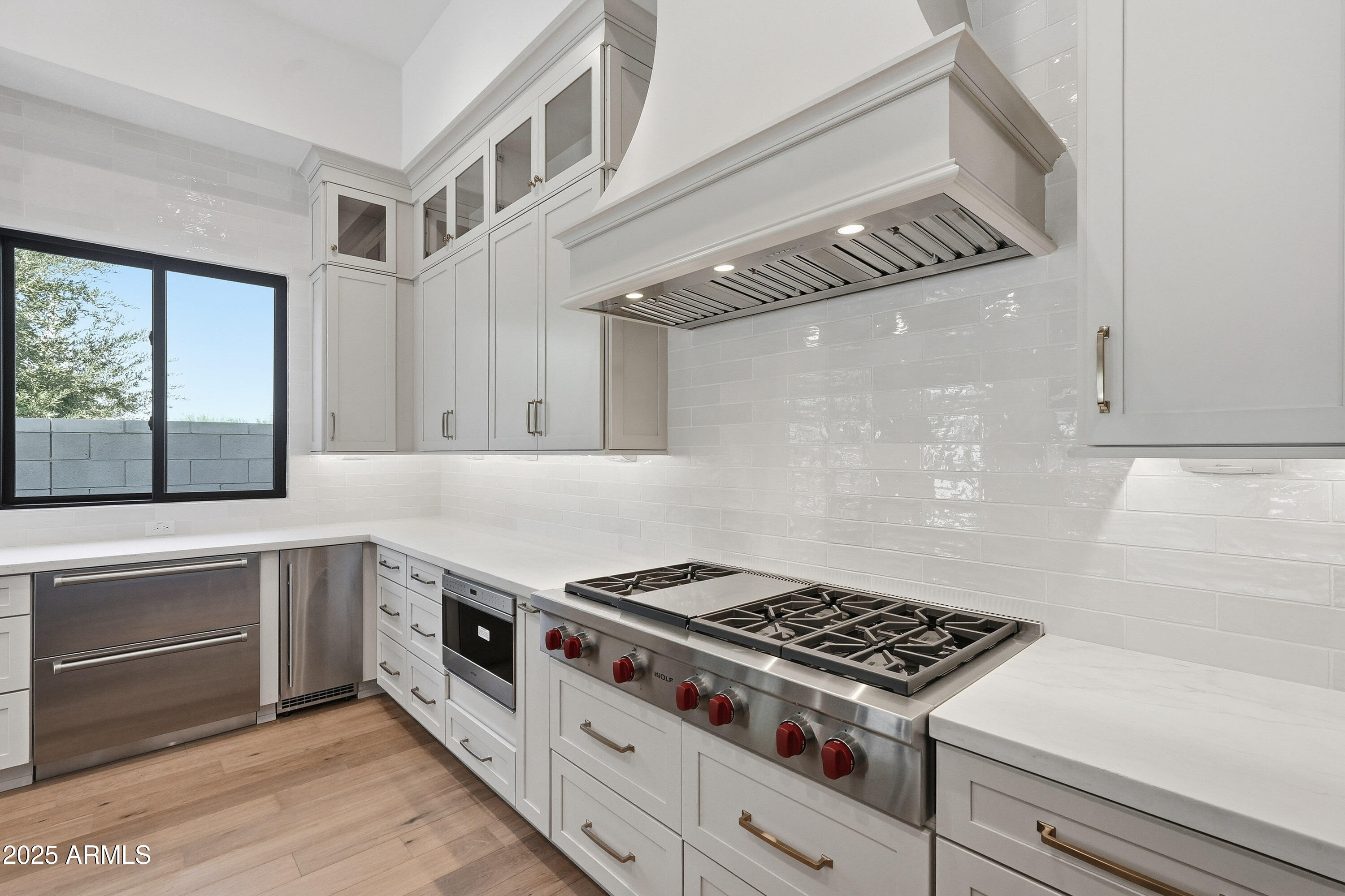 3326 South Stuart Court Gilbert, AZ 85297 - Photo 9 of 88 a kitchen with stainless steel appliances cabinets and a window
