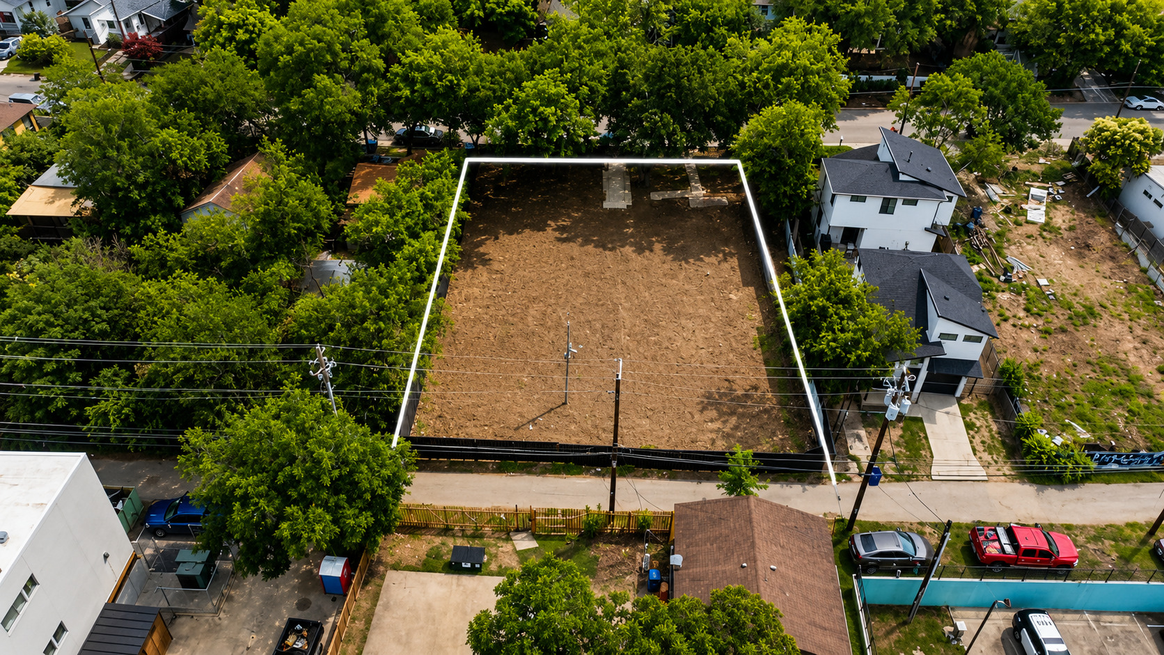 2017 East 8th Street Austin, TX 78702 - Photo 1 of 7 A promising, cleared lot awaits development, surrounded by mature trees.