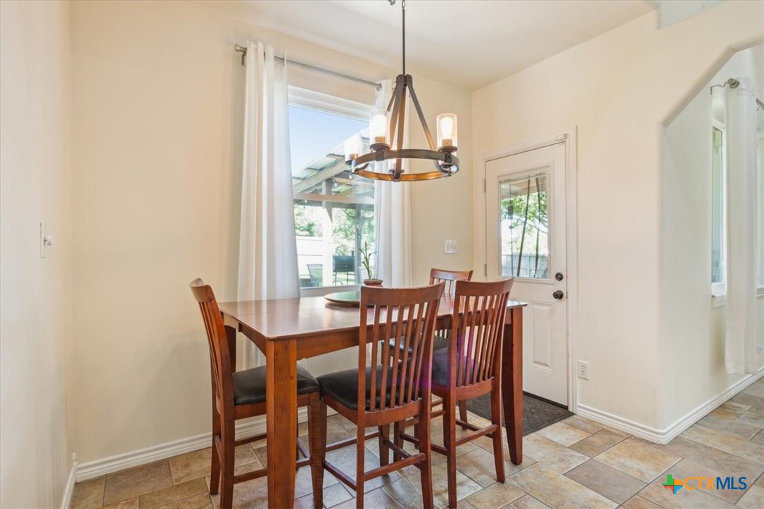 5306 Denmans Loop Belton, TX 76513 - Photo 11 of 46 a view of a dining room with furniture window and chandelier