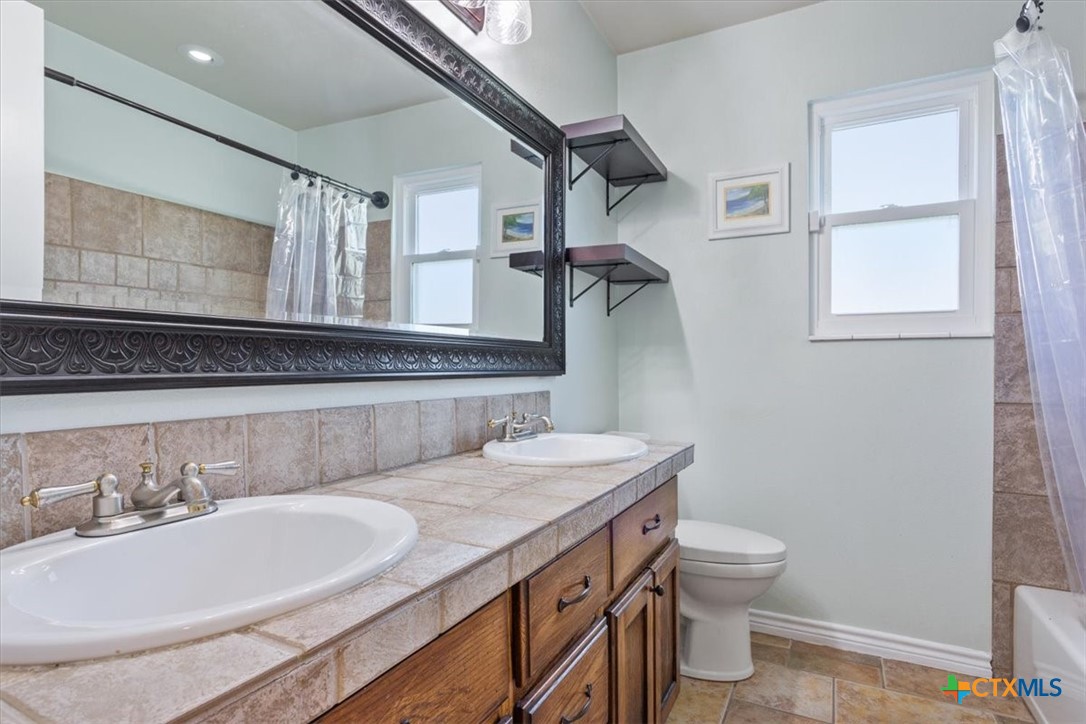 5306 Denmans Loop Belton, TX 76513 - Photo 15 of 46 a bathroom with a sink and a mirror