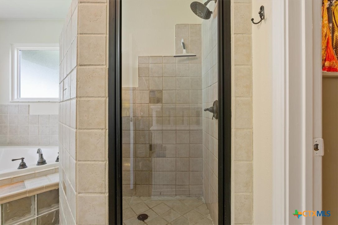 5306 Denmans Loop Belton, TX 76513 - Photo 16 of 46 a bathroom with a bathtub and shower