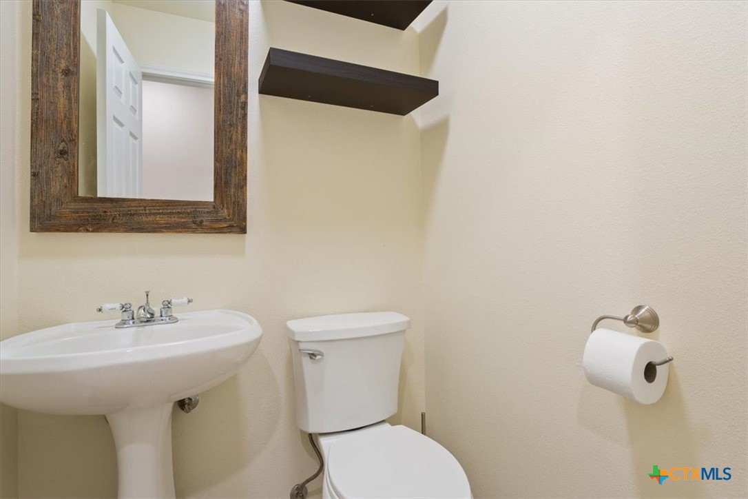5306 Denmans Loop Belton, TX 76513 - Photo 18 of 46 a bathroom with a toilet sink and mirror