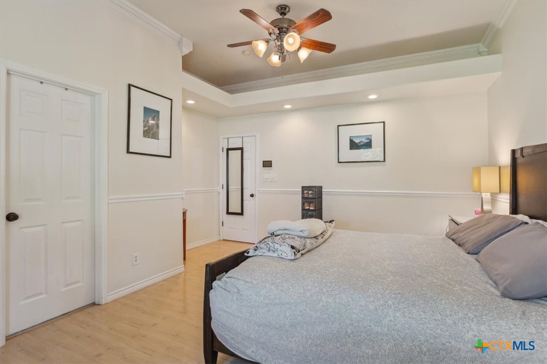 5306 Denmans Loop Belton, TX 76513 - Photo 26 of 46 a bedroom with a bed and a lamp