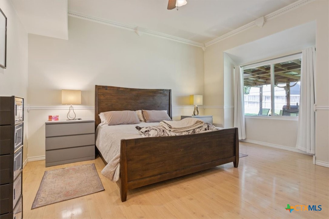 5306 Denmans Loop Belton, TX 76513 - Photo 27 of 46 a bed sitting in a bedroom next to a window