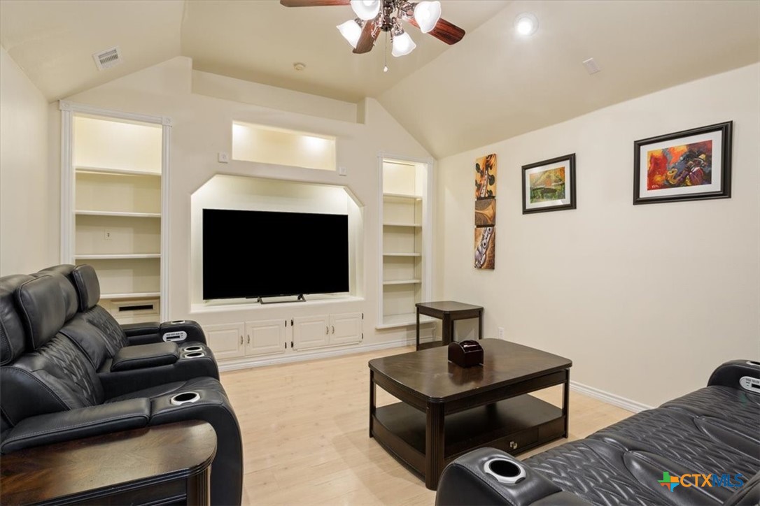 5306 Denmans Loop Belton, TX 76513 - Photo 6 of 46 a living room with furniture and a flat screen tv