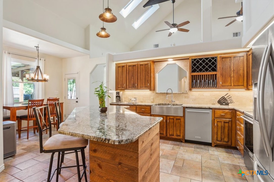 5306 Denmans Loop Belton, TX 76513 - Photo 8 of 46 a kitchen with a table chairs stove and cabinets