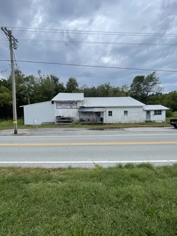 a view of a big yard with a house