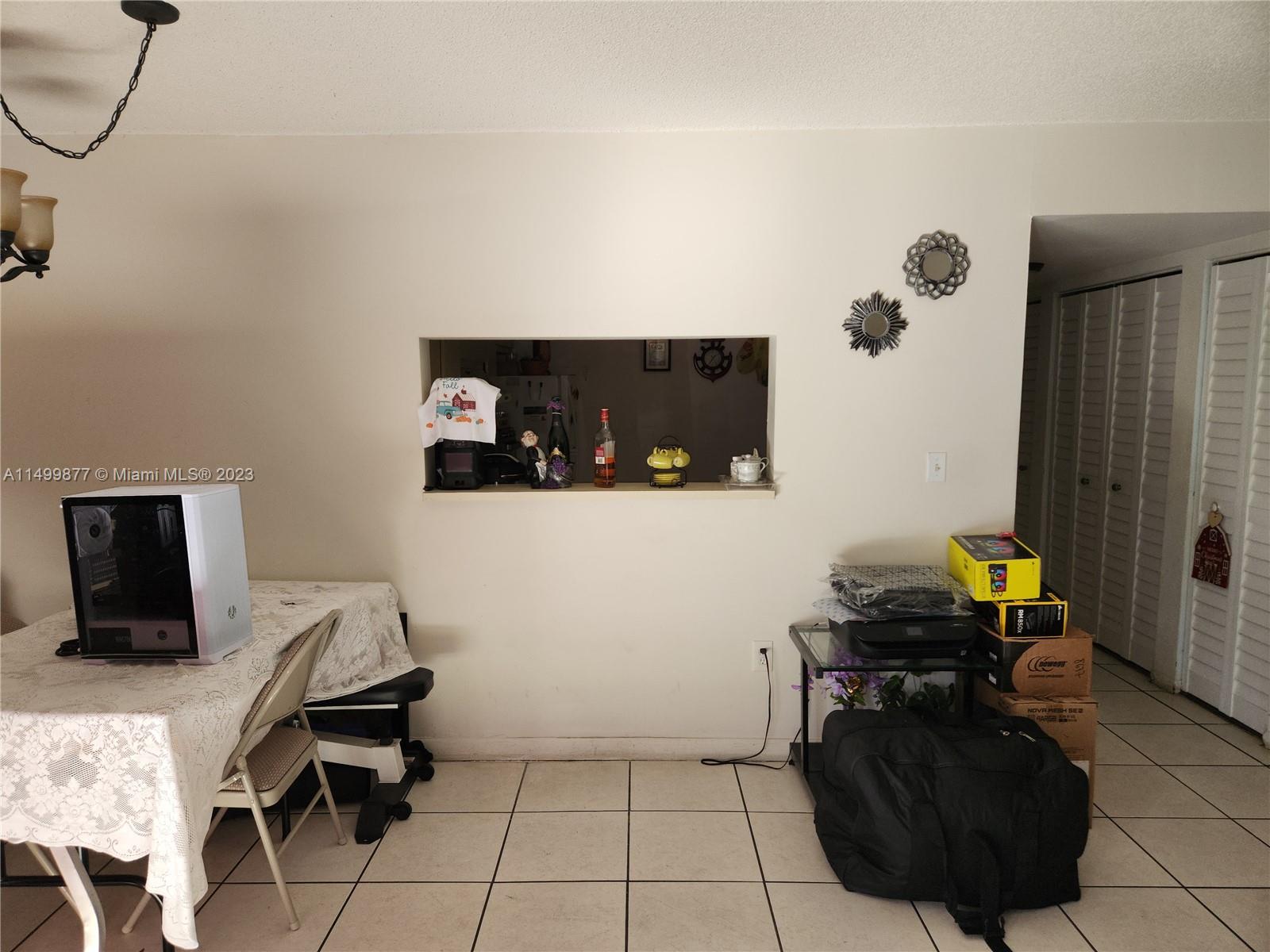 3601 Southwest 117th Avenue, Unit 9104 Miami, FL 33165 - Photo 5 of 9 a living room with furniture and a flat screen tv