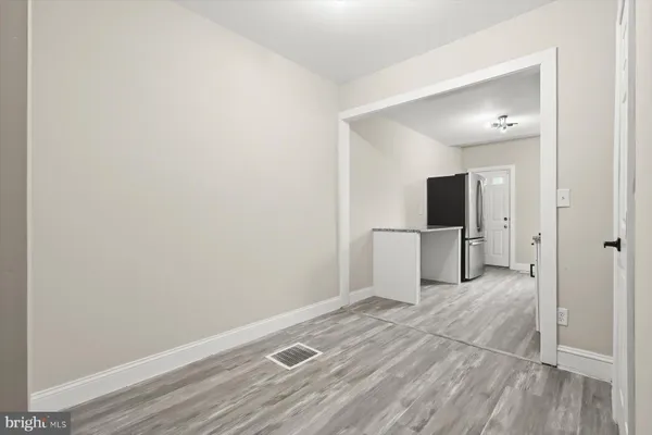 a view of empty room with a flat screen tv