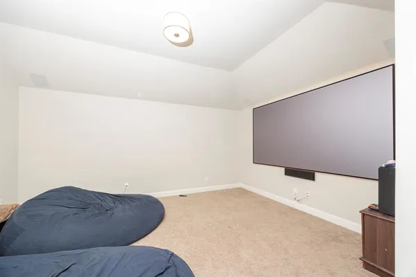 a bedroom with a bed and walk in closet