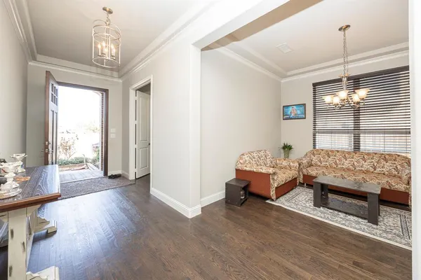 a bedroom with furniture and a chandelier