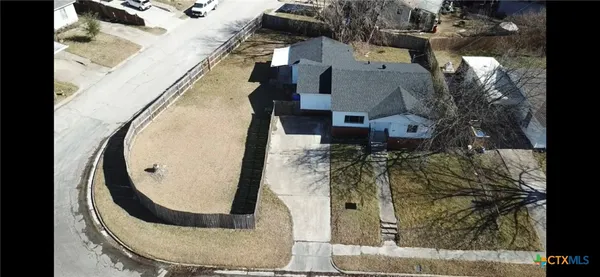 an aerial view of a highlighted house