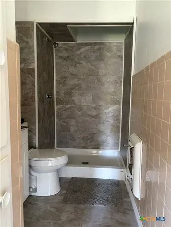 an empty room with a empty space and windows