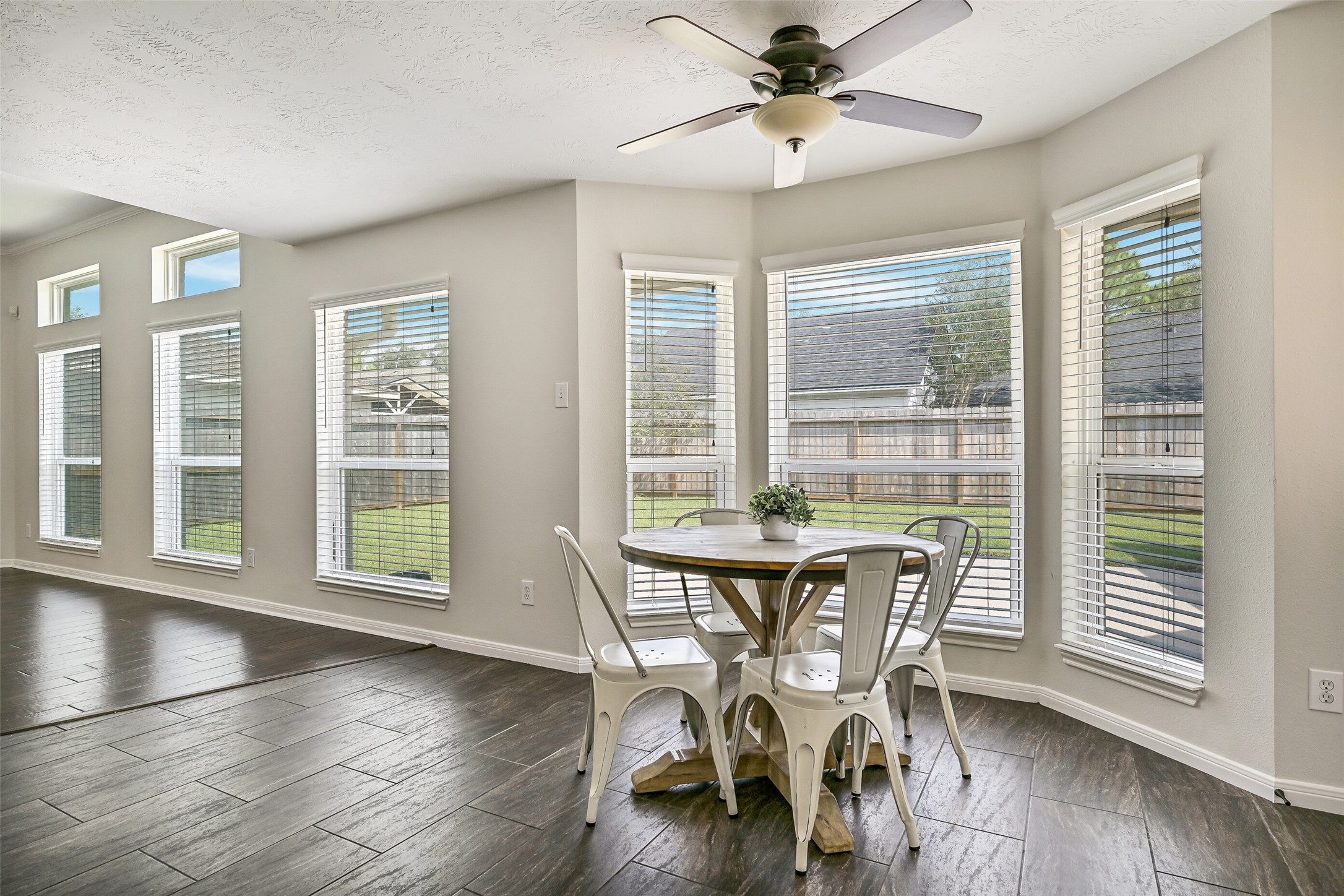 2015 Stonecrest Way Pearland, TX 77581 - Photo 12 of 26 a view of a dining room with furniture window and wooden floor