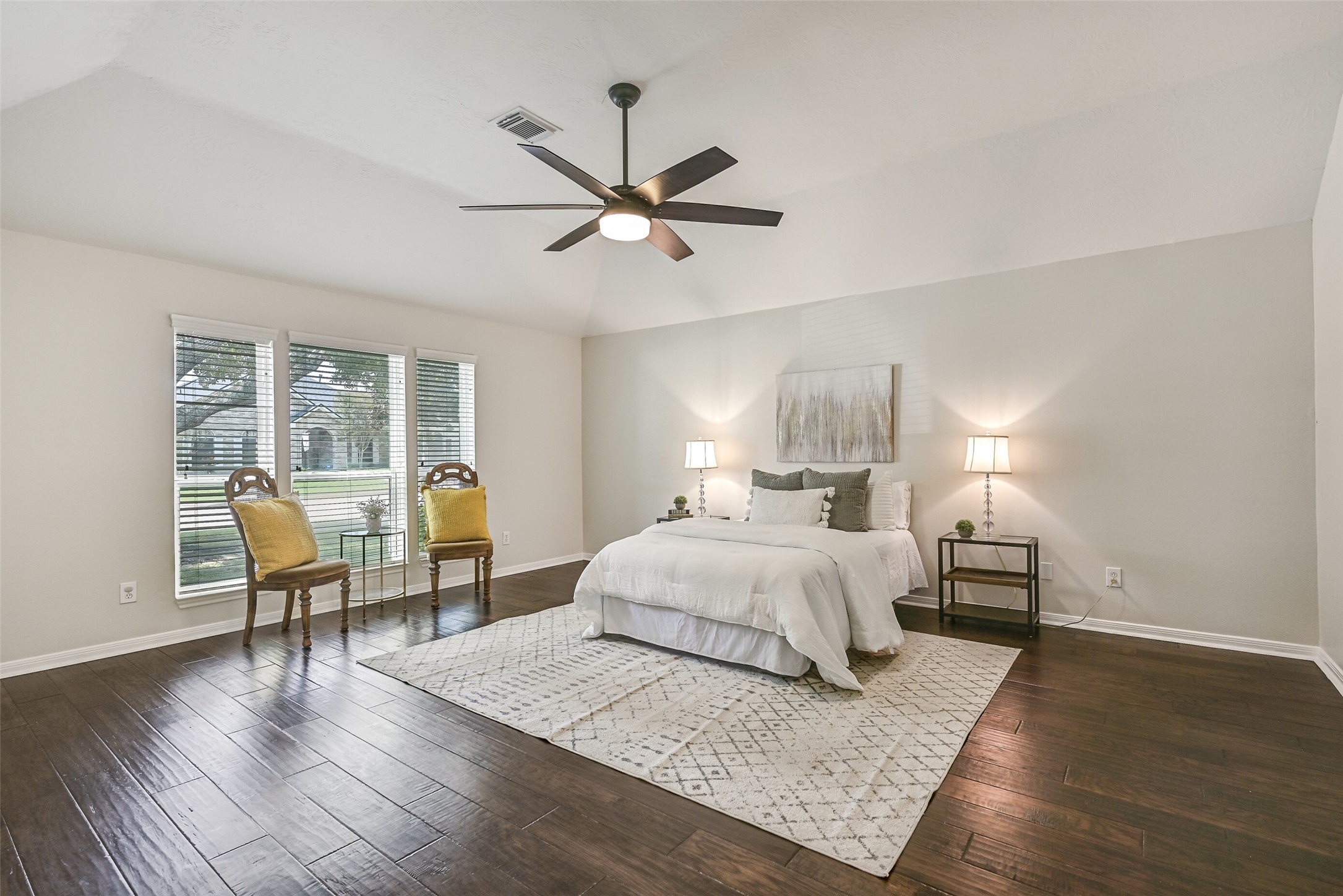 2015 Stonecrest Way Pearland, TX 77581 - Photo 20 of 26 a bedroom with a bed and wooden floor