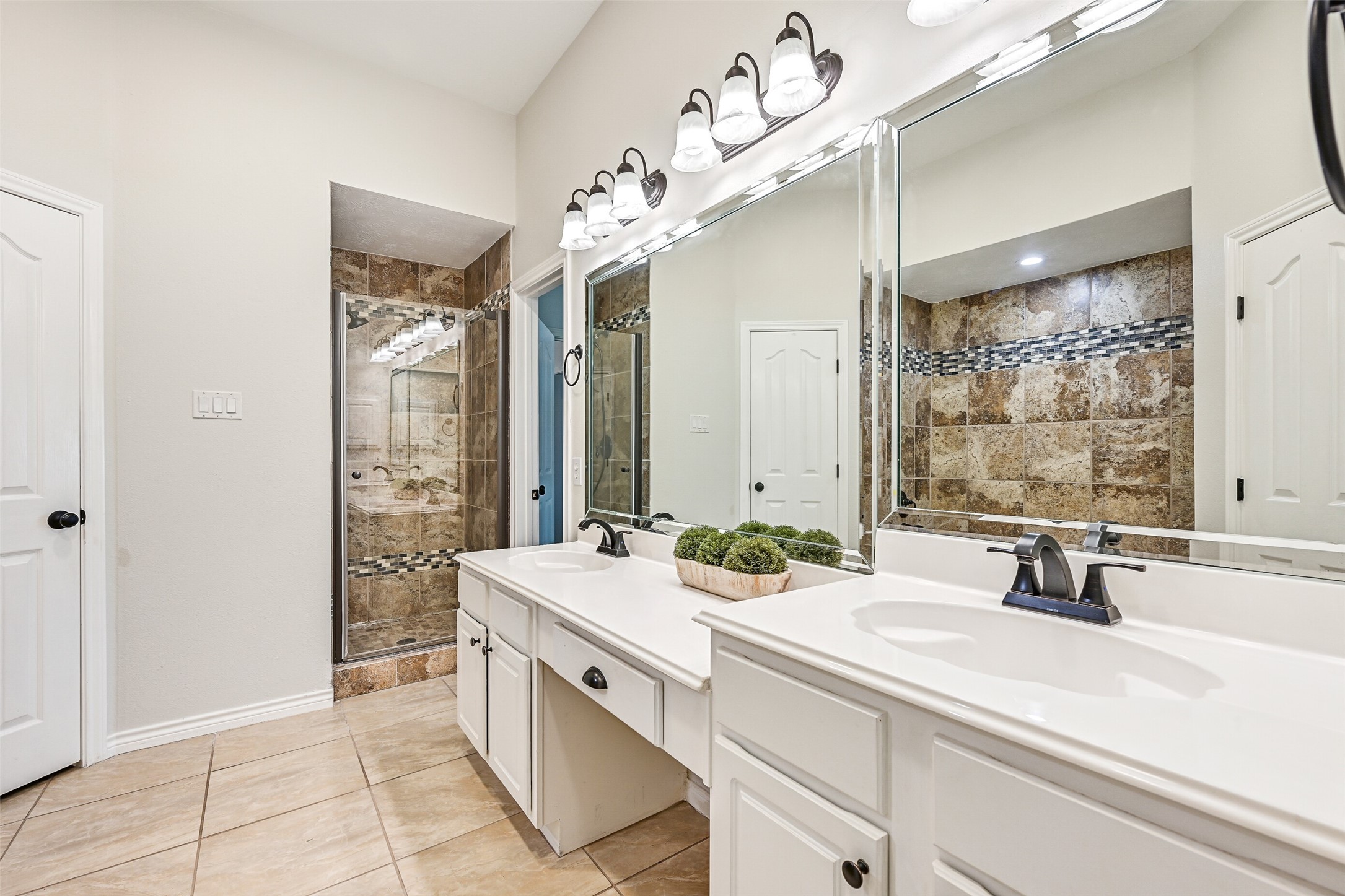 2015 Stonecrest Way Pearland, TX 77581 - Photo 21 of 26 a bathroom with a sink double vanity and a mirror