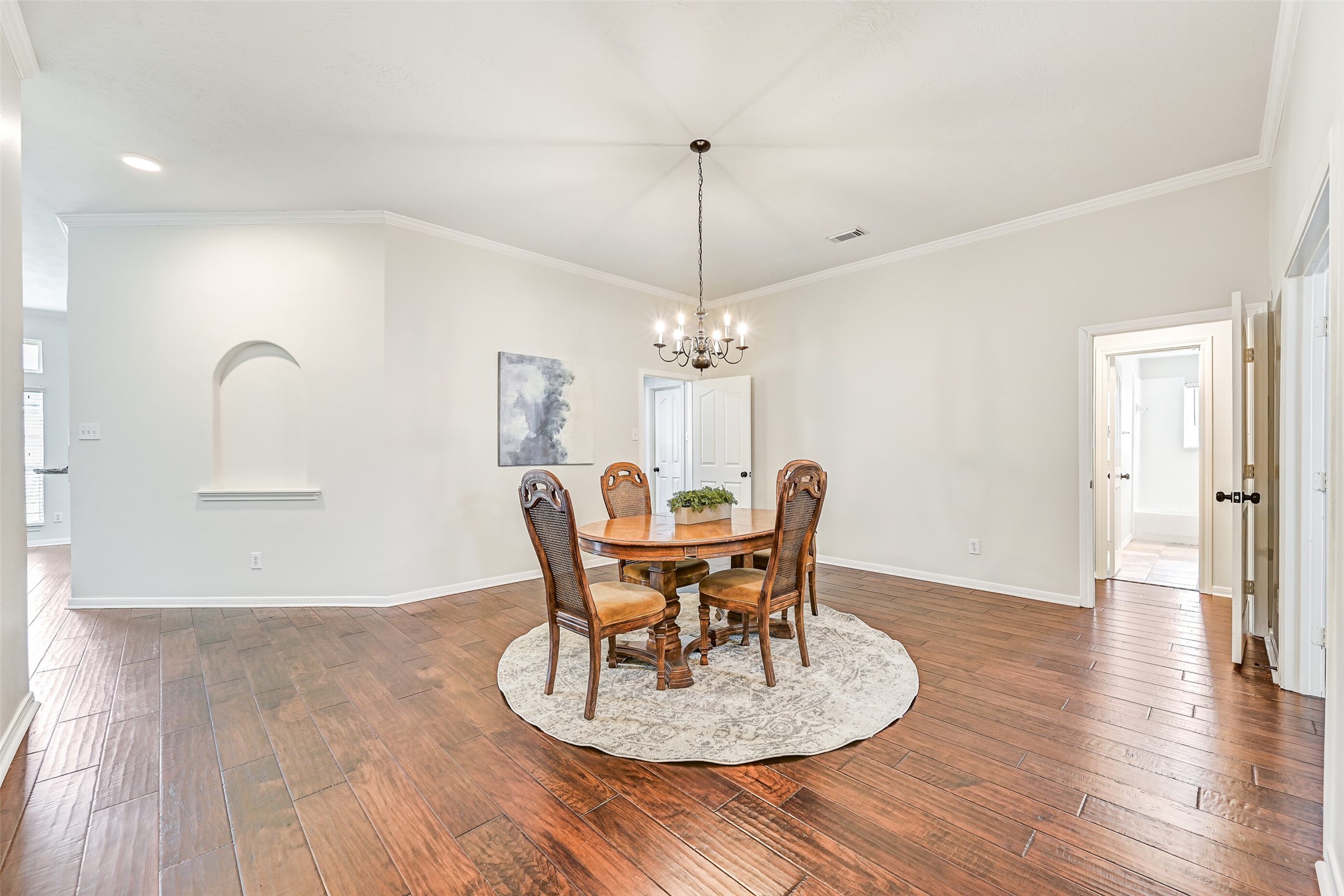 2015 Stonecrest Way Pearland, TX 77581 - Photo 6 of 26 a dining room with furniture a chandelier and wooden floor