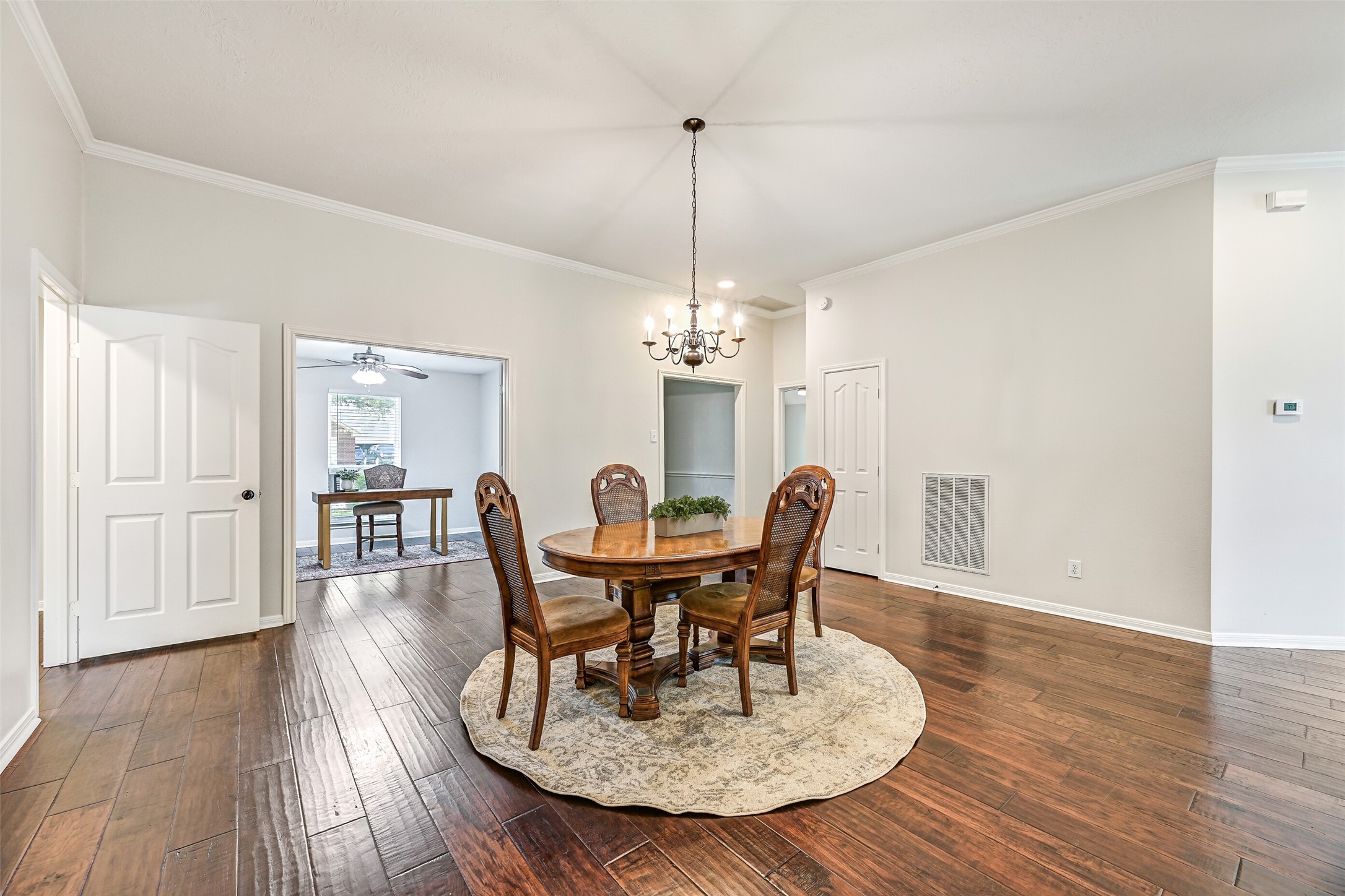 2015 Stonecrest Way Pearland, TX 77581 - Photo 7 of 26 a view of a dining room with furniture window and wooden floor