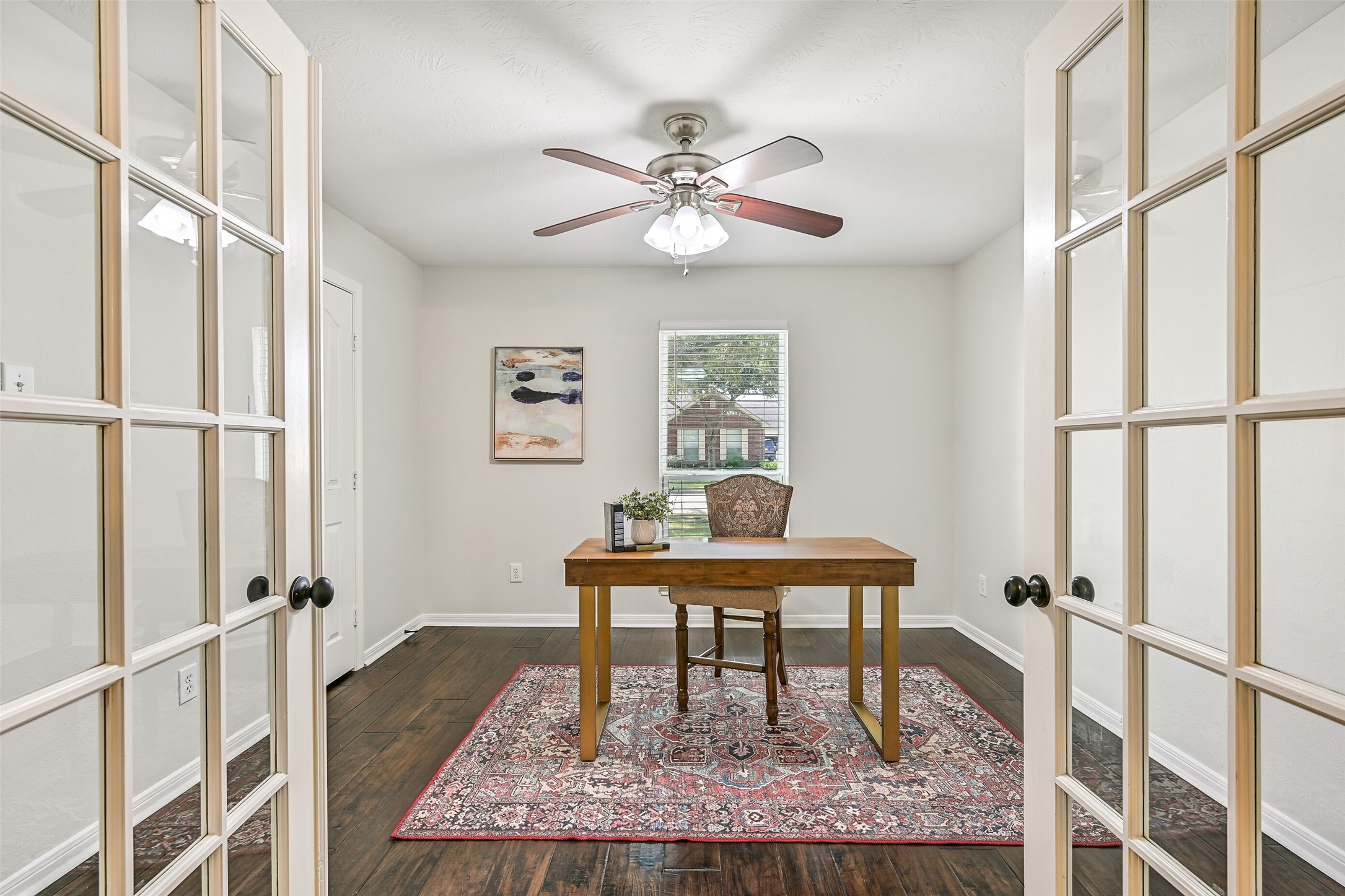 2015 Stonecrest Way Pearland, TX 77581 - Photo 9 of 26 a view of a hallway that has a table and a window