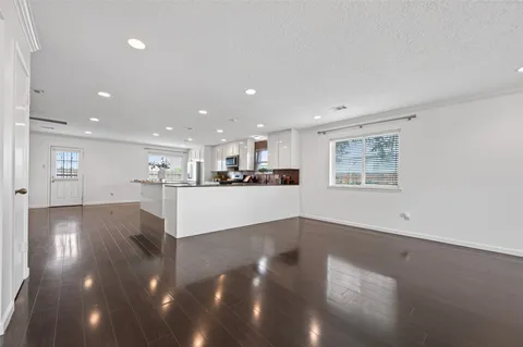 a view of a dining room kitchen with furniture and wooden floor
