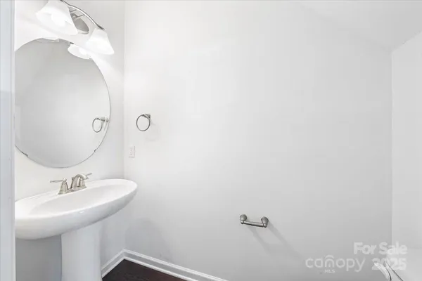 a bathroom with a sink and mirror
