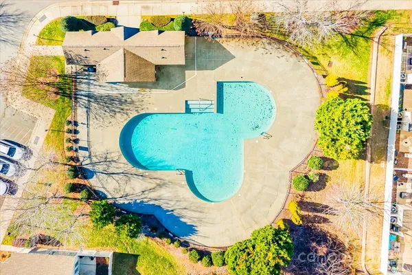 an aerial view of a house with swimming pool