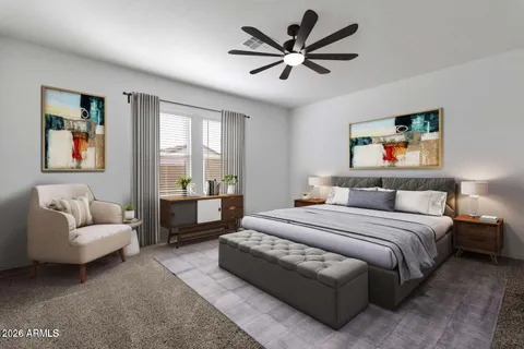 a spacious bedroom with a bed a couch and a window