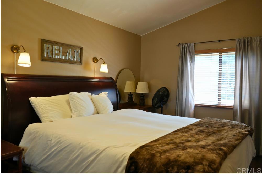 7192 Sandy Creek Road Julian, CA 92036 - Photo 13 of 64 a bedroom with a bed and a painting on the wall