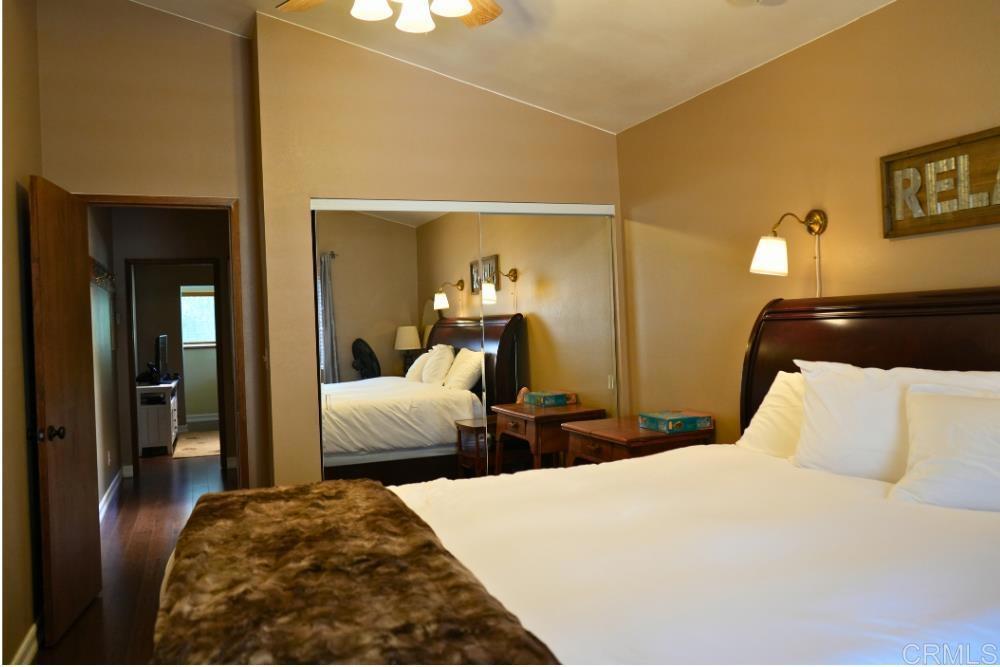 7192 Sandy Creek Road Julian, CA 92036 - Photo 14 of 64 a bedroom with two beds and a chandelier