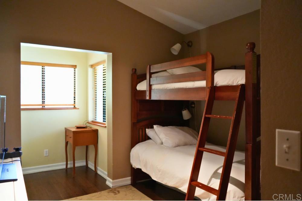 7192 Sandy Creek Road Julian, CA 92036 - Photo 18 of 64 a bedroom with a bed and a window