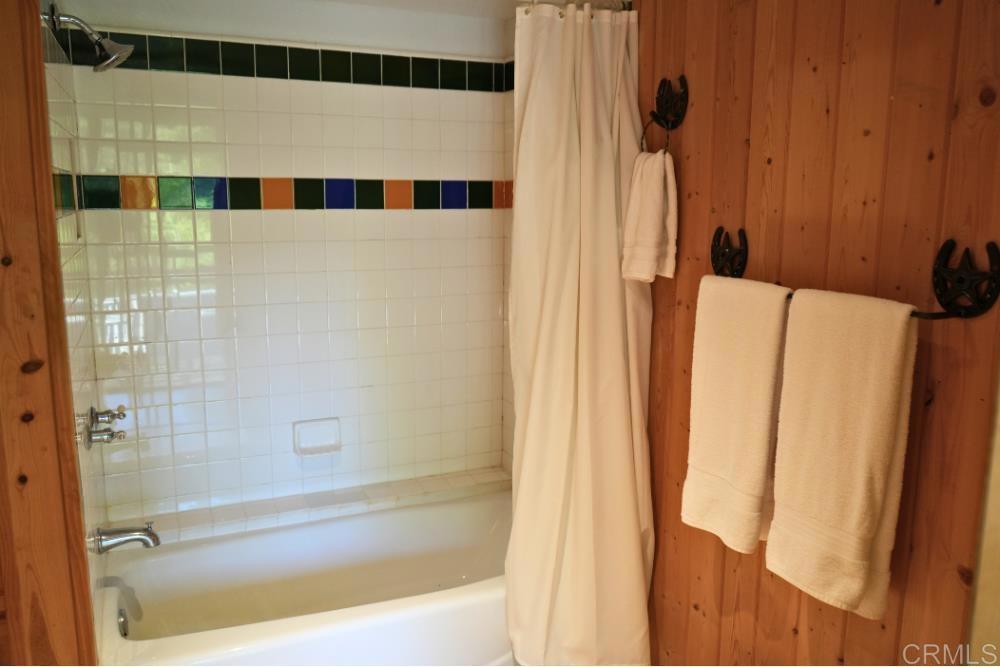 7192 Sandy Creek Road Julian, CA 92036 - Photo 29 of 64 a bathroom with a bathtub and a shower