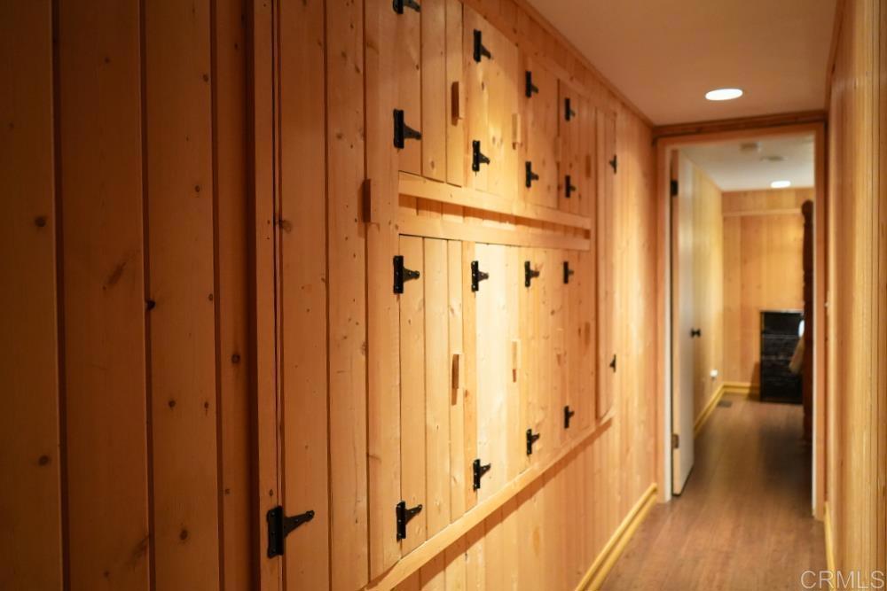 7192 Sandy Creek Road Julian, CA 92036 - Photo 32 of 64 a view of a hallway with wooden floor