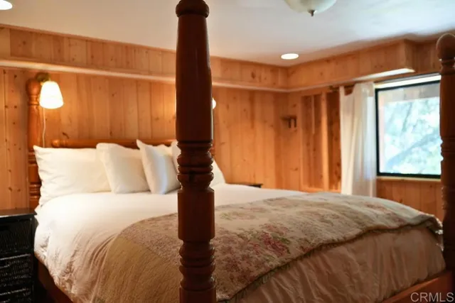 a view of house with wooden fence