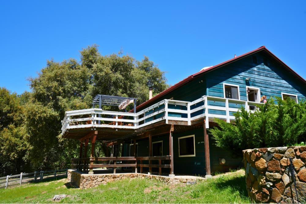 7192 Sandy Creek Road Julian, CA 92036 - Photo 40 of 64 a view of a house with backyard porch and sitting area