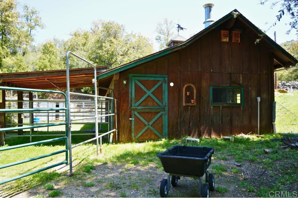7192 Sandy Creek Road Julian, CA 92036 - Photo 45 of 64 a backyard of a house with table and chairs