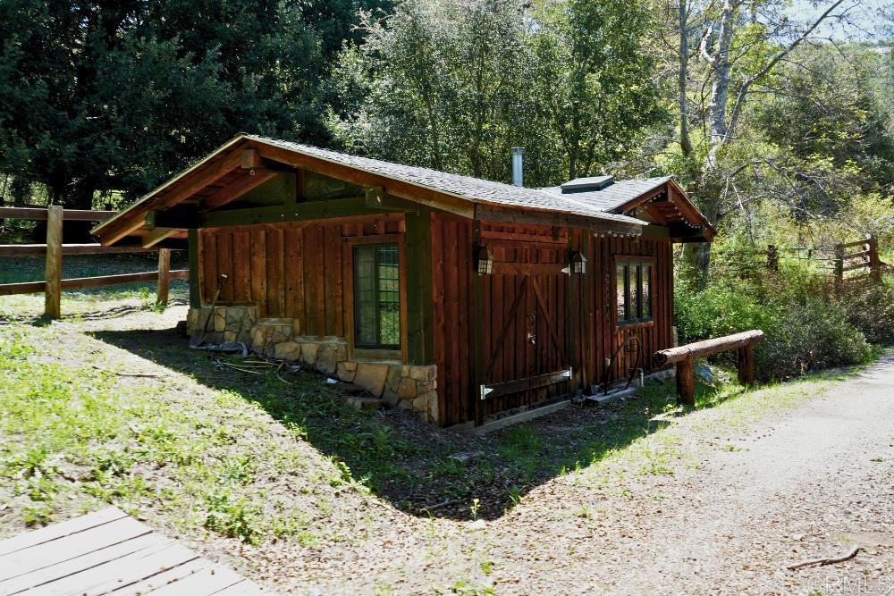 7192 Sandy Creek Road Julian, CA 92036 - Photo 49 of 64 a view of a small house with wooden fence