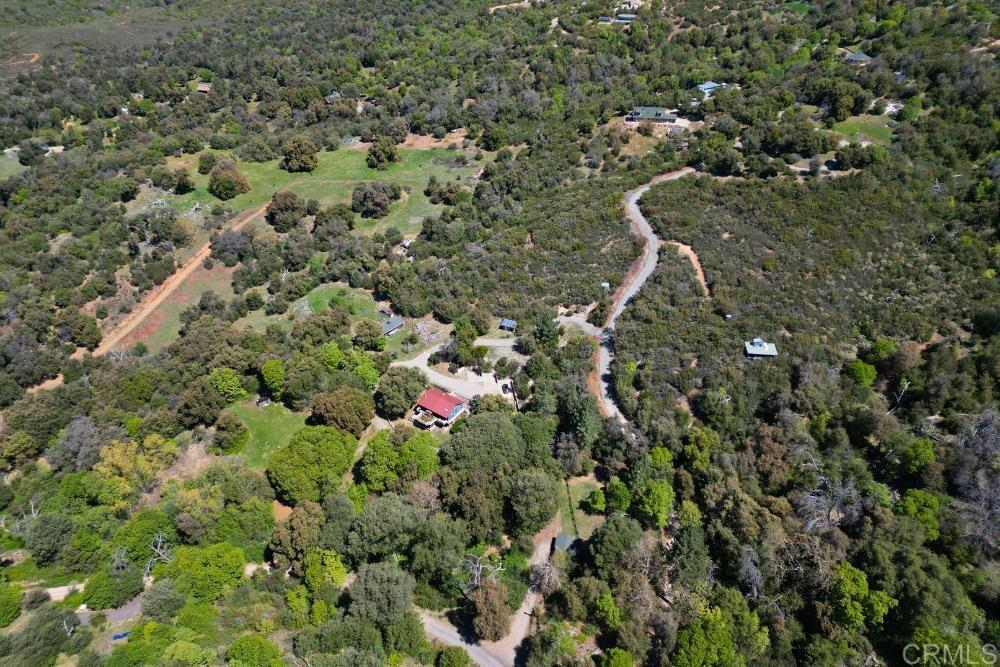 7192 Sandy Creek Road Julian, CA 92036 - Photo 57 of 64 a view of a house with a lush green forest