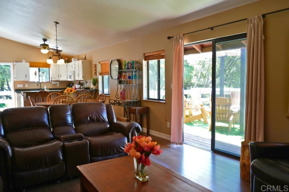 7192 Sandy Creek Road Julian, CA 92036 - Photo 9 of 64 a living room with furniture and a floor to ceiling window