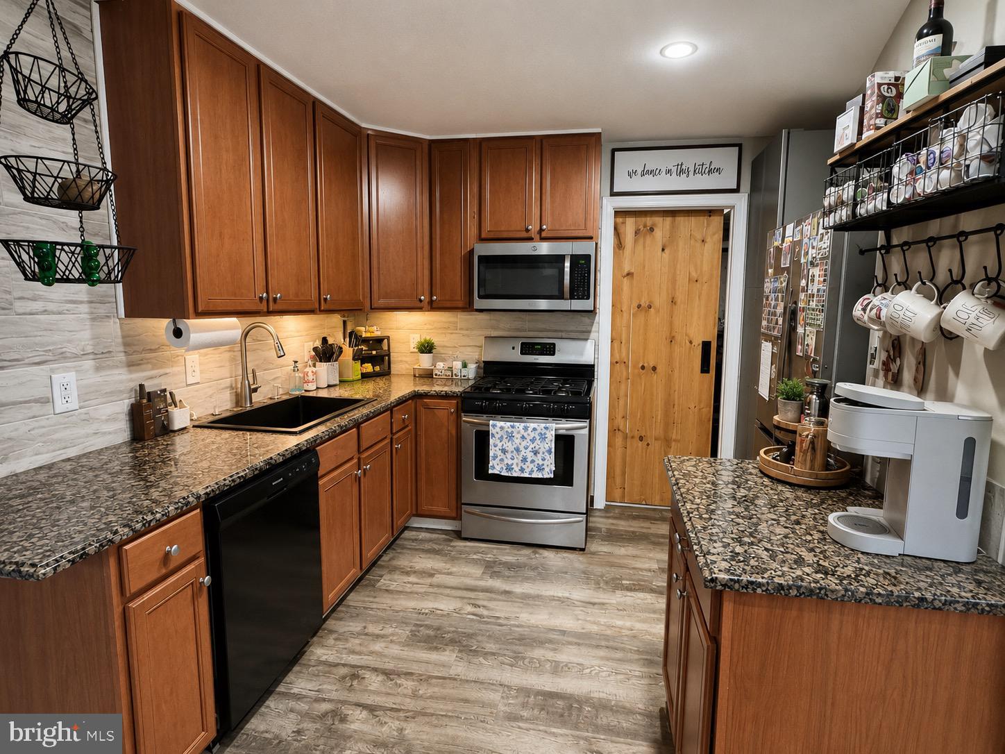 54 Warwick Road Stratford, NJ 08084 - Photo 3 of 8 Modern kitchen with warm wood tones.
