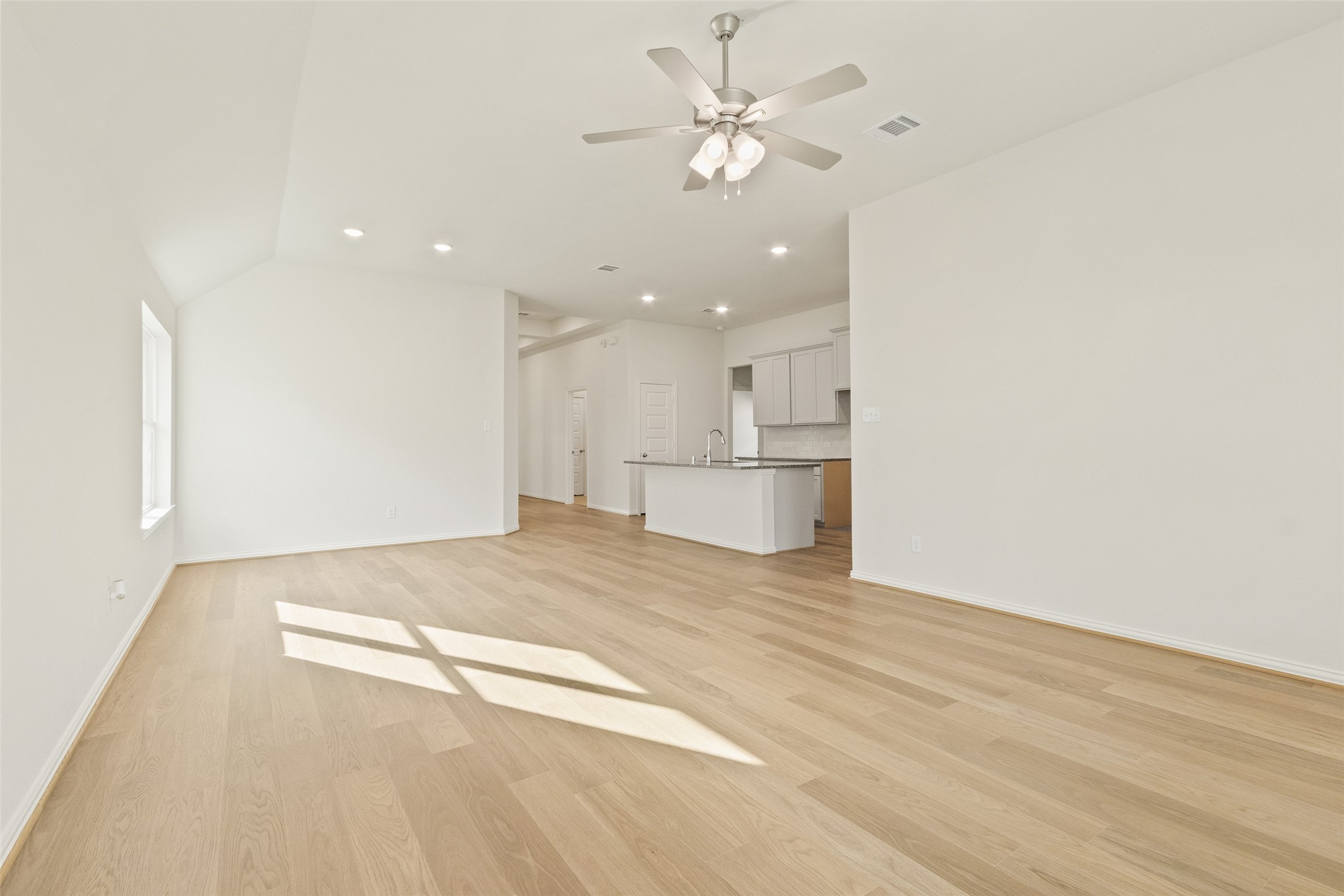 431 Fields Forest Lane Dayton, TX 77535 - Photo 14 of 36 a view of a kitchen with a sink and a refrigerator