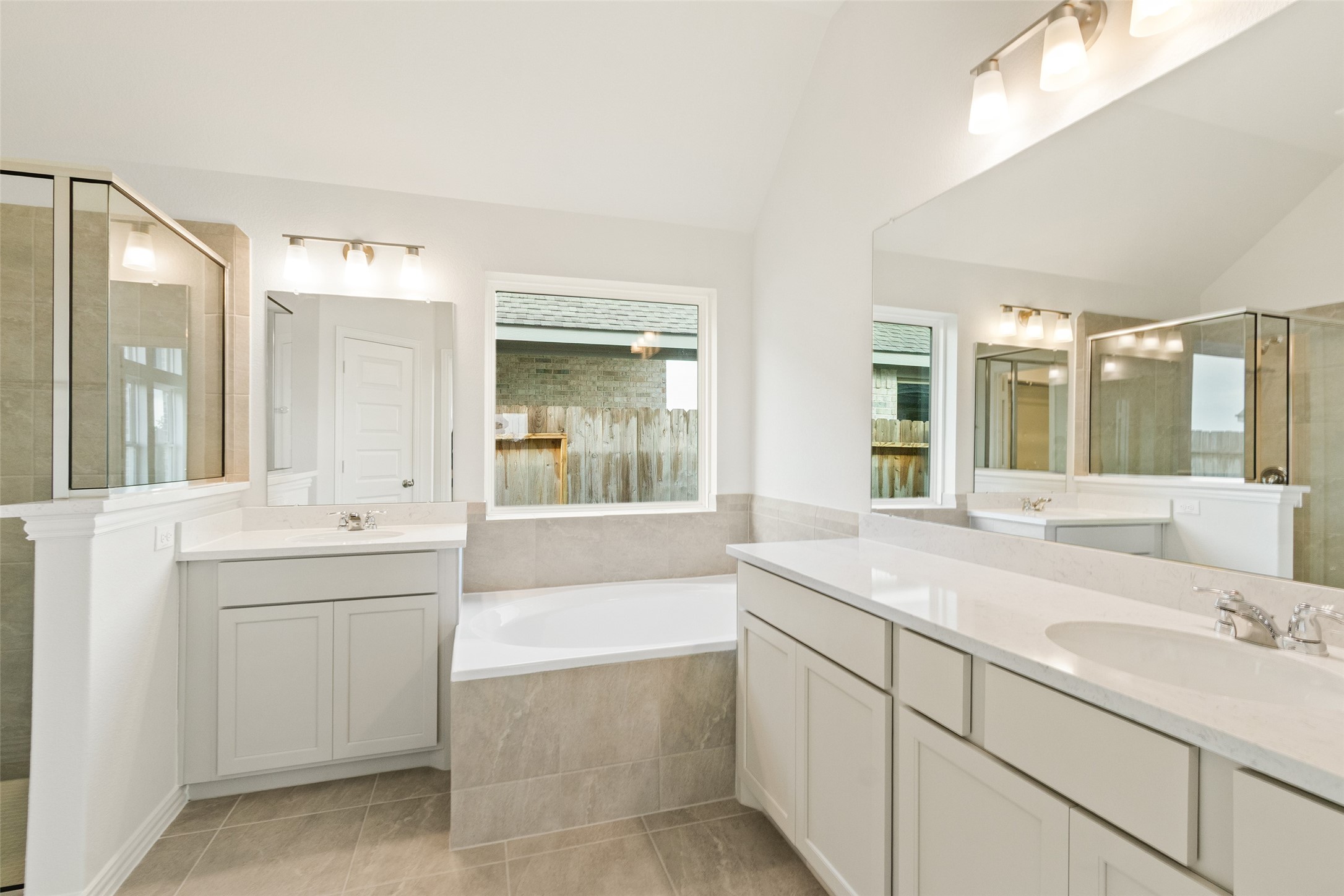 431 Fields Forest Lane Dayton, TX 77535 - Photo 18 of 36 a bathroom with a tub sink and mirror