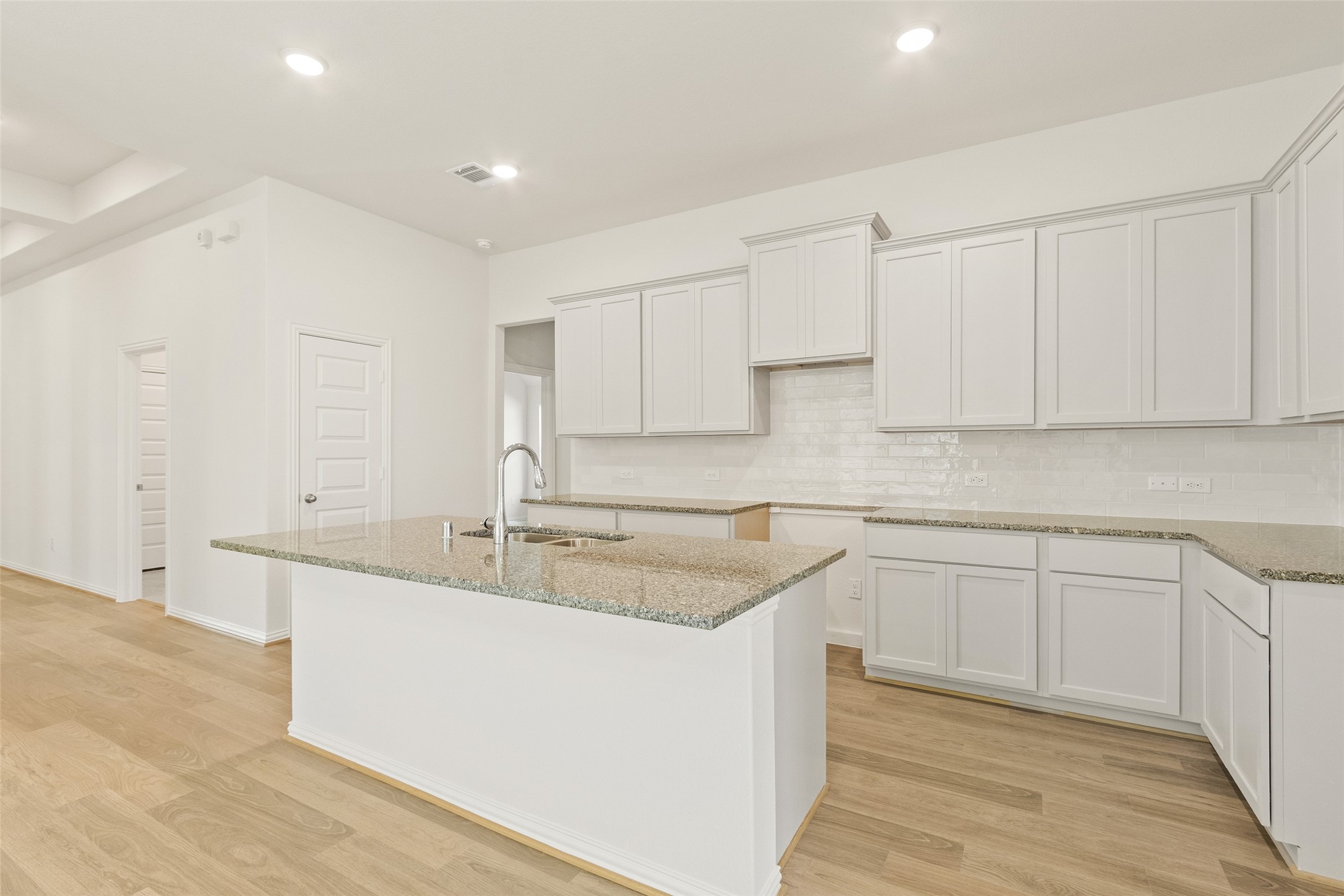 431 Fields Forest Lane Dayton, TX 77535 - Photo 9 of 36 a kitchen with stainless steel appliances granite countertop a sink and white cabinets