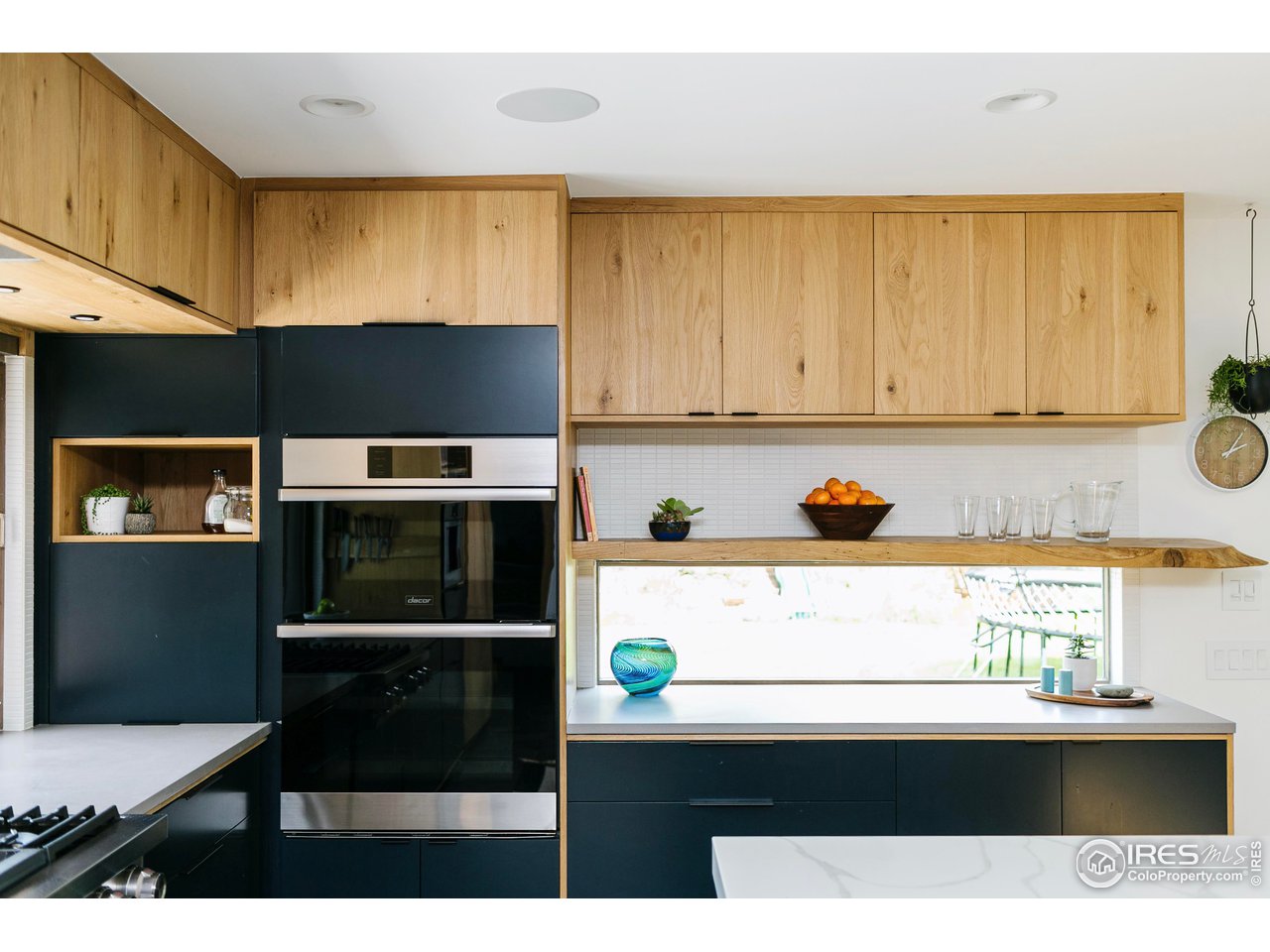 2600 West Prospect Road Fort Collins, CO 80526 - Photo 17 of 40 a kitchen with a sink a stove and a microwave